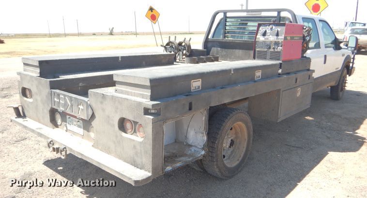 image for item FY9691 2004 Ford F350 Super Duty XLT Crew Cab utility bed pickup truck