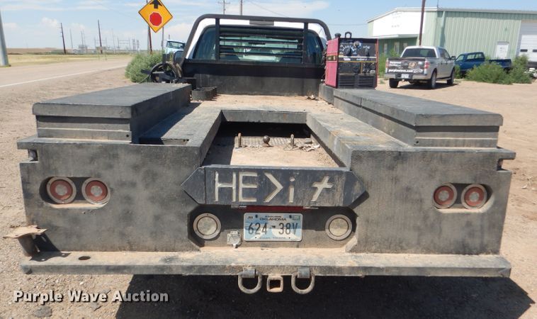 image for item FY9691 2004 Ford F350 Super Duty XLT Crew Cab utility bed pickup truck