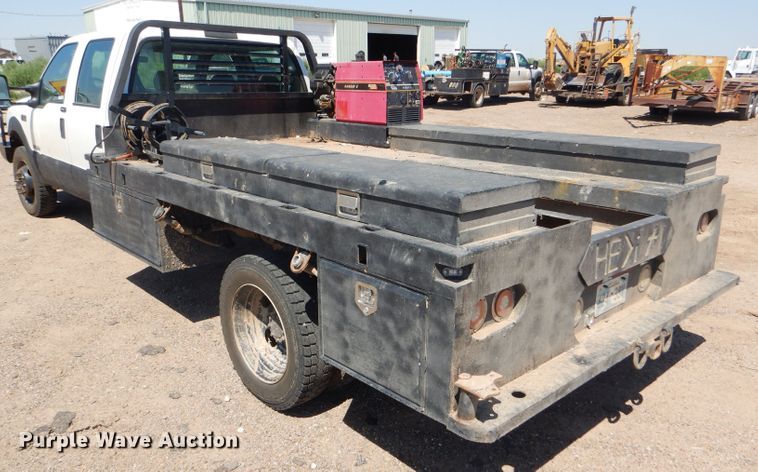 image for item FY9691 2004 Ford F350 Super Duty XLT Crew Cab utility bed pickup truck