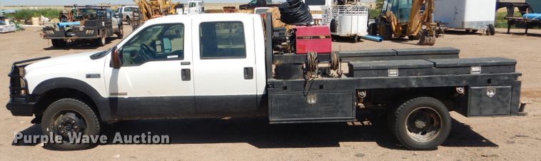 image for item FY9691 2004 Ford F350 Super Duty XLT Crew Cab utility bed pickup truck