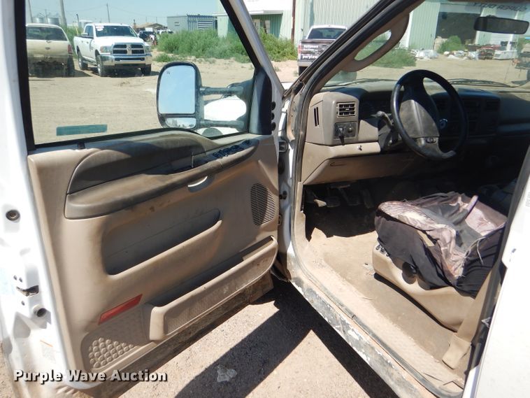 image for item FY9691 2004 Ford F350 Super Duty XLT Crew Cab utility bed pickup truck