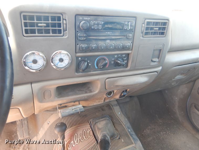 image for item FY9691 2004 Ford F350 Super Duty XLT Crew Cab utility bed pickup truck