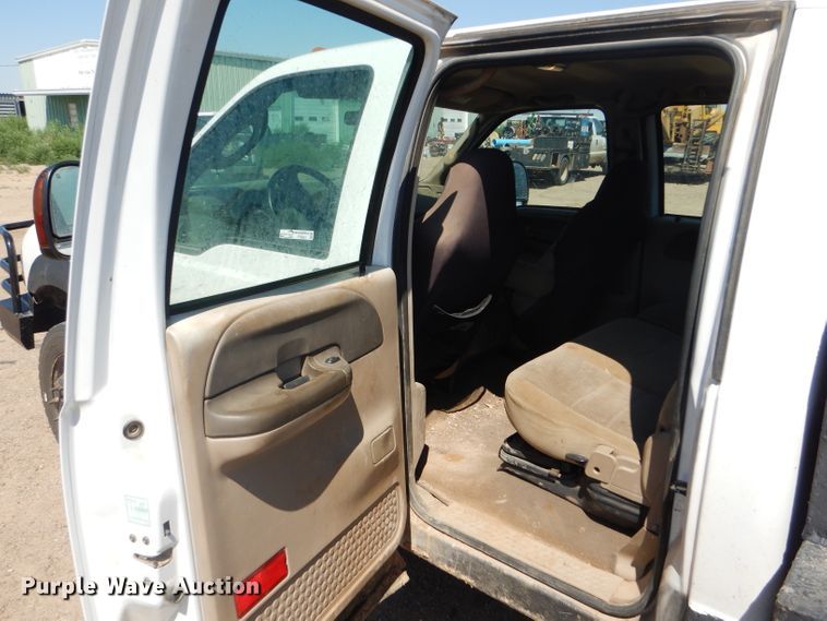 image for item FY9691 2004 Ford F350 Super Duty XLT Crew Cab utility bed pickup truck