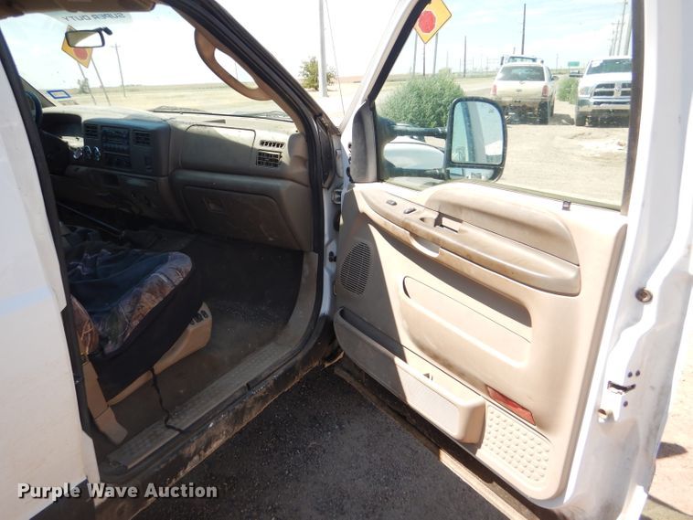 image for item FY9691 2004 Ford F350 Super Duty XLT Crew Cab utility bed pickup truck