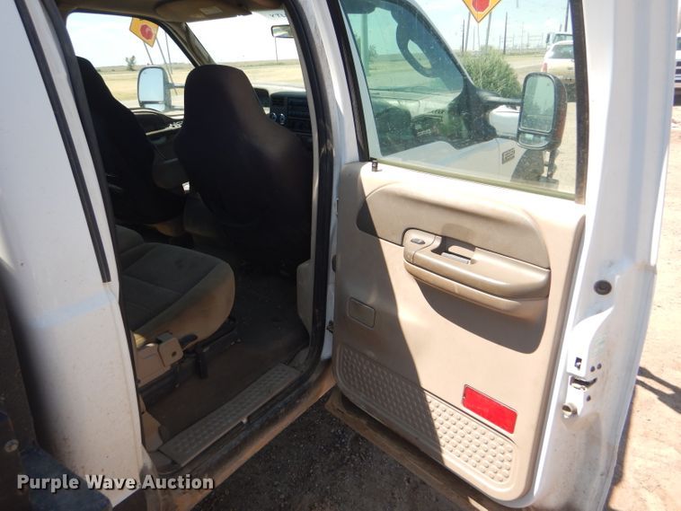 image for item FY9691 2004 Ford F350 Super Duty XLT Crew Cab utility bed pickup truck