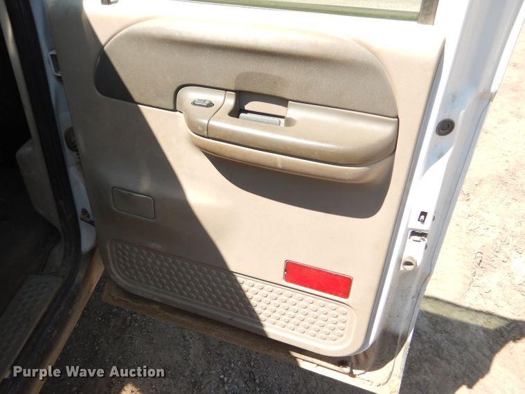 image for item FY9691 2004 Ford F350 Super Duty XLT Crew Cab utility bed pickup truck