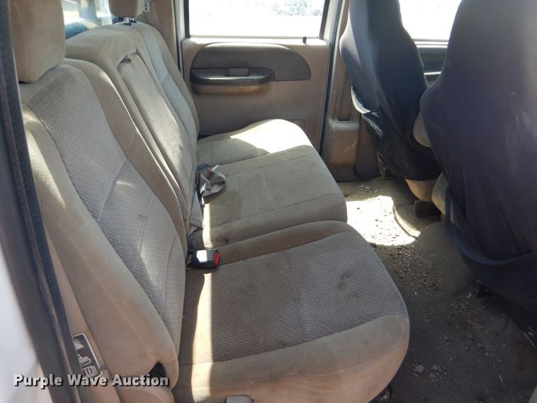 image for item FY9691 2004 Ford F350 Super Duty XLT Crew Cab utility bed pickup truck