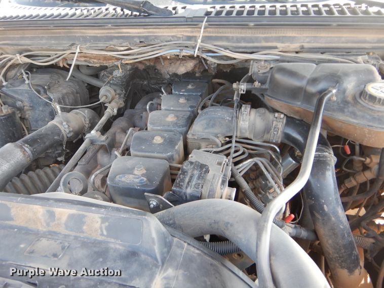 image for item FY9691 2004 Ford F350 Super Duty XLT Crew Cab utility bed pickup truck