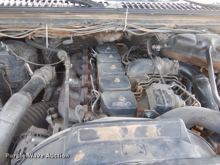 image for item FY9691 2004 Ford F350 Super Duty XLT Crew Cab utility bed pickup truck