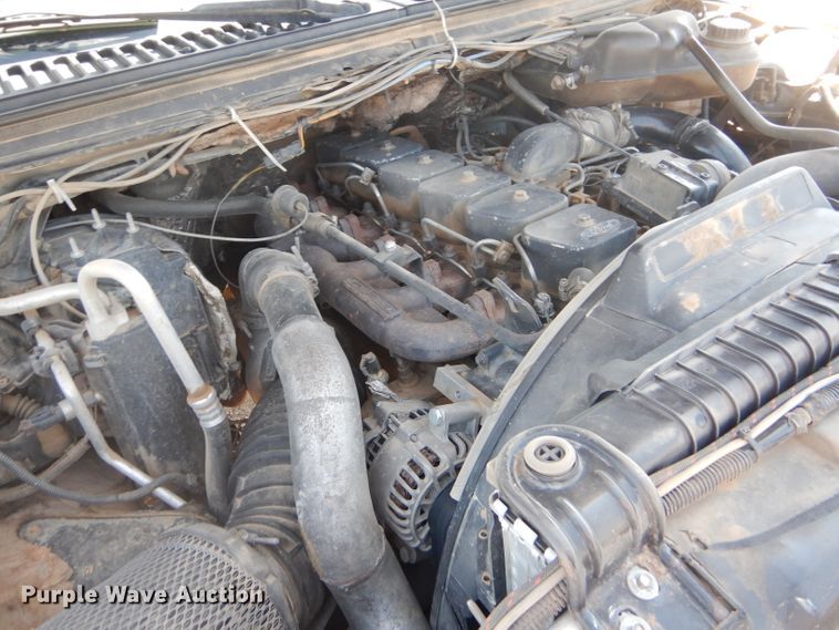 image for item FY9691 2004 Ford F350 Super Duty XLT Crew Cab utility bed pickup truck