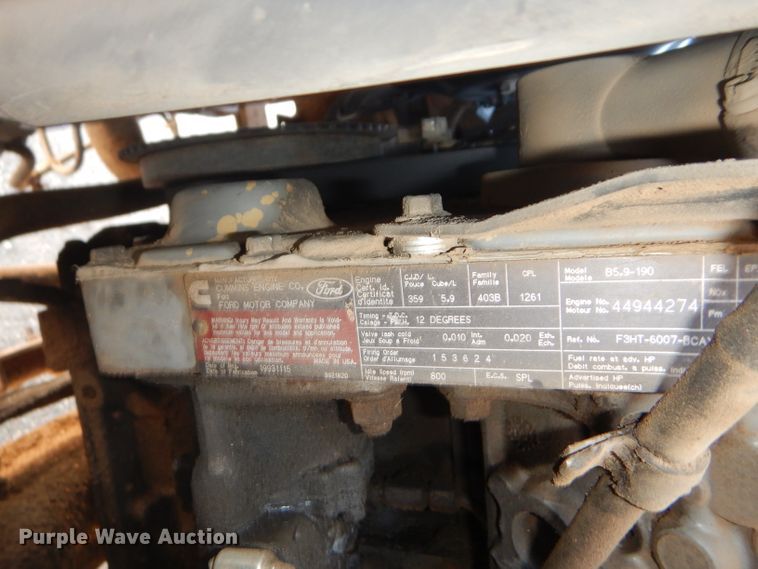 image for item FY9691 2004 Ford F350 Super Duty XLT Crew Cab utility bed pickup truck