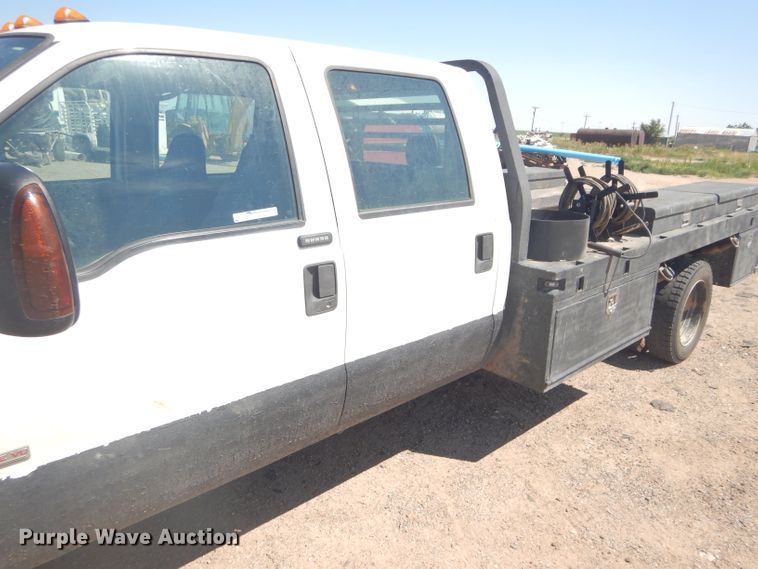 image for item FY9691 2004 Ford F350 Super Duty XLT Crew Cab utility bed pickup truck