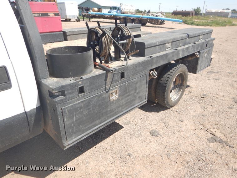 image for item FY9691 2004 Ford F350 Super Duty XLT Crew Cab utility bed pickup truck