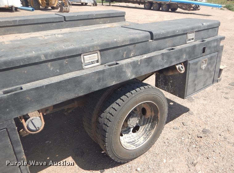 image for item FY9691 2004 Ford F350 Super Duty XLT Crew Cab utility bed pickup truck