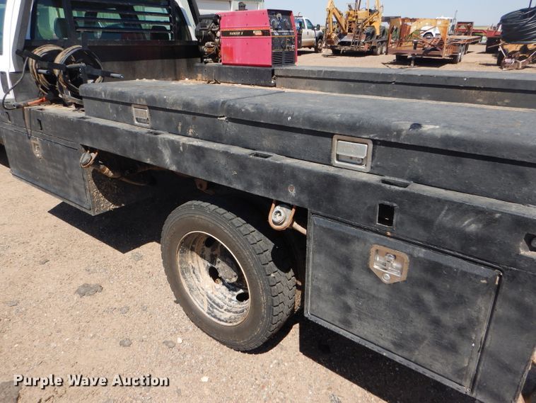 image for item FY9691 2004 Ford F350 Super Duty XLT Crew Cab utility bed pickup truck