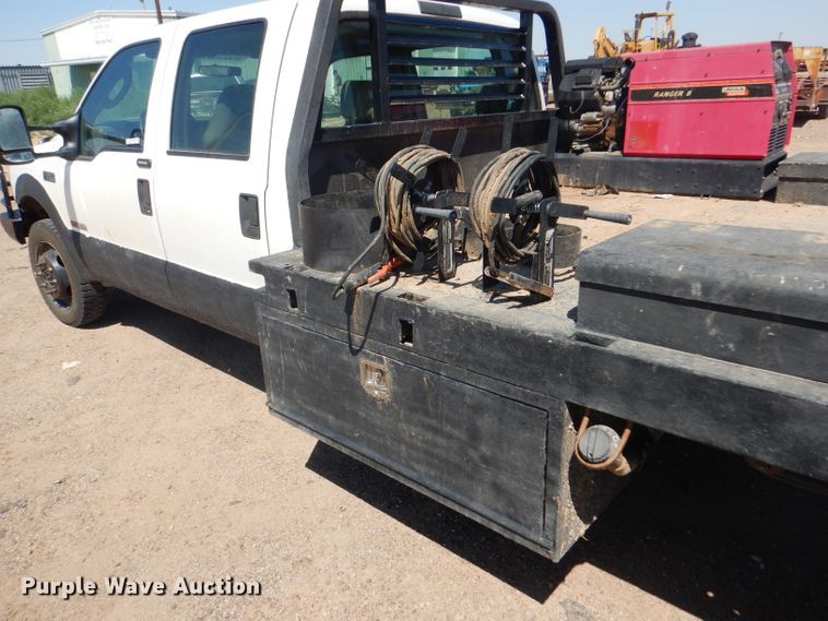 image for item FY9691 2004 Ford F350 Super Duty XLT Crew Cab utility bed pickup truck