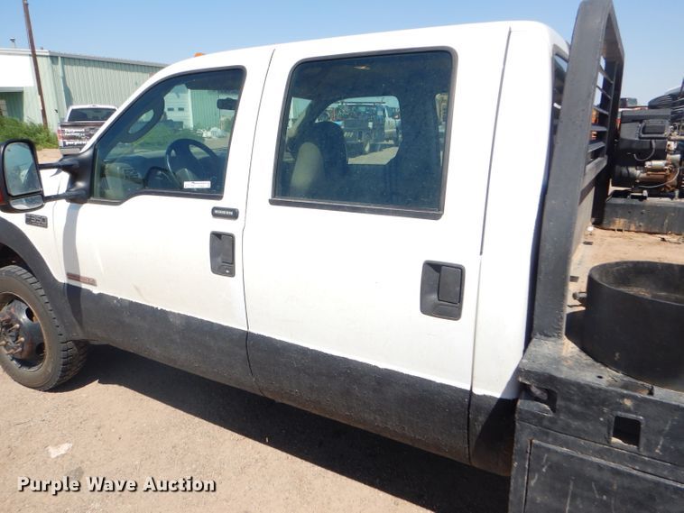 image for item FY9691 2004 Ford F350 Super Duty XLT Crew Cab utility bed pickup truck