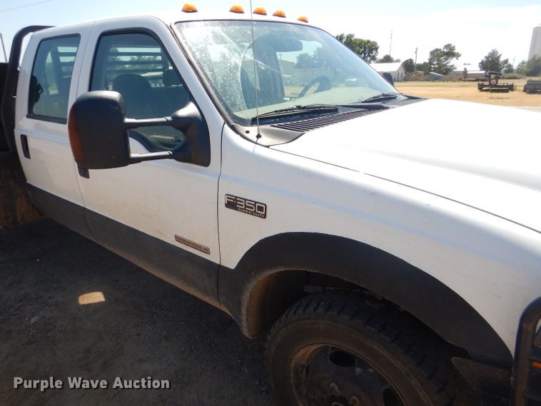 image for item FY9691 2004 Ford F350 Super Duty XLT Crew Cab utility bed pickup truck