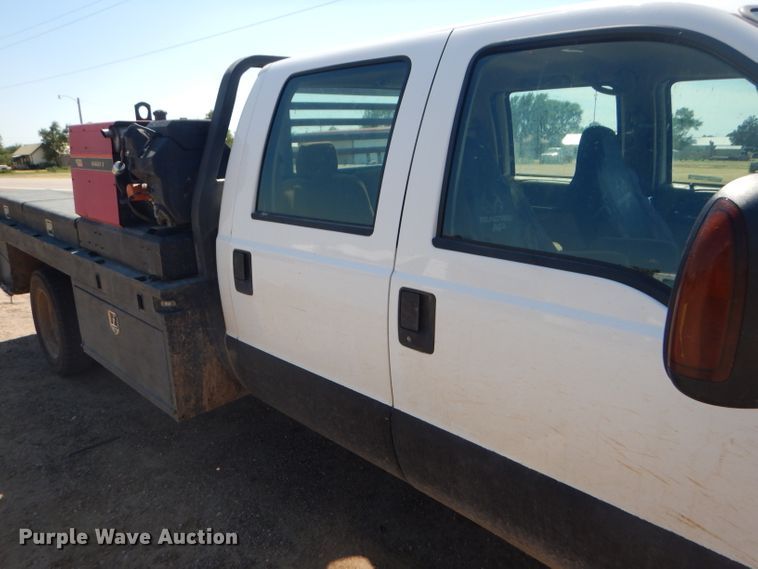 image for item FY9691 2004 Ford F350 Super Duty XLT Crew Cab utility bed pickup truck