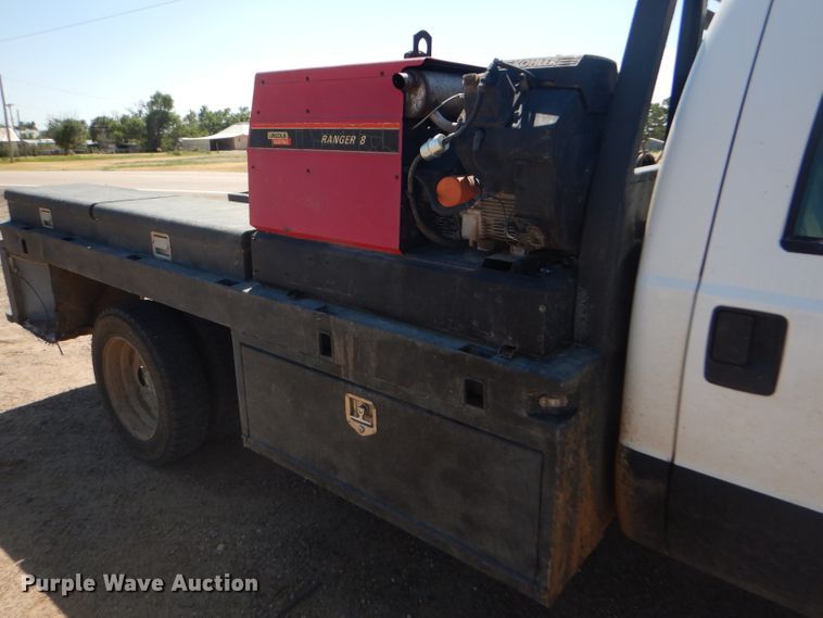 image for item FY9691 2004 Ford F350 Super Duty XLT Crew Cab utility bed pickup truck