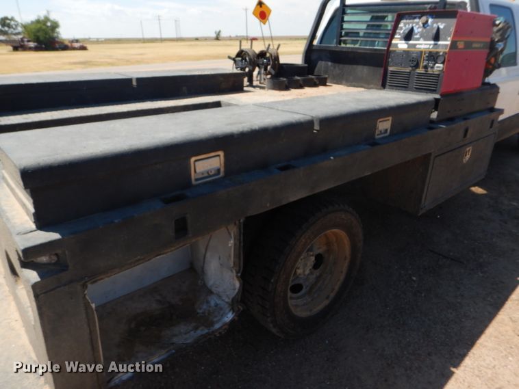 image for item FY9691 2004 Ford F350 Super Duty XLT Crew Cab utility bed pickup truck