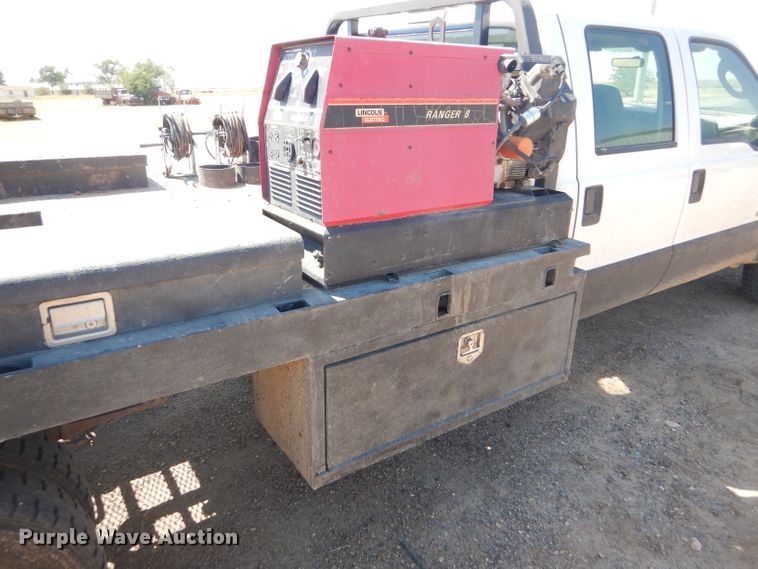 image for item FY9691 2004 Ford F350 Super Duty XLT Crew Cab utility bed pickup truck