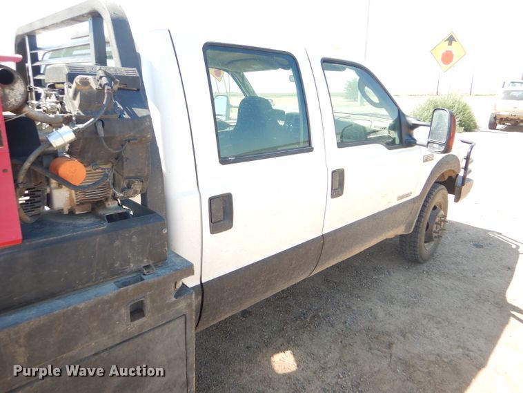 image for item FY9691 2004 Ford F350 Super Duty XLT Crew Cab utility bed pickup truck