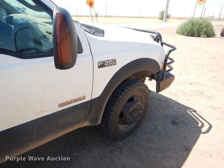 image for item FY9691 2004 Ford F350 Super Duty XLT Crew Cab utility bed pickup truck