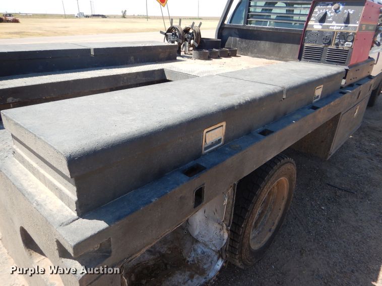 image for item FY9691 2004 Ford F350 Super Duty XLT Crew Cab utility bed pickup truck
