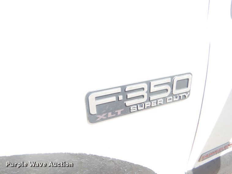 image for item FY9691 2004 Ford F350 Super Duty XLT Crew Cab utility bed pickup truck