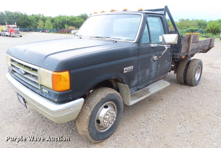 image for item DD6383 1990 Ford F450 Super Duty flat dump bed truck
