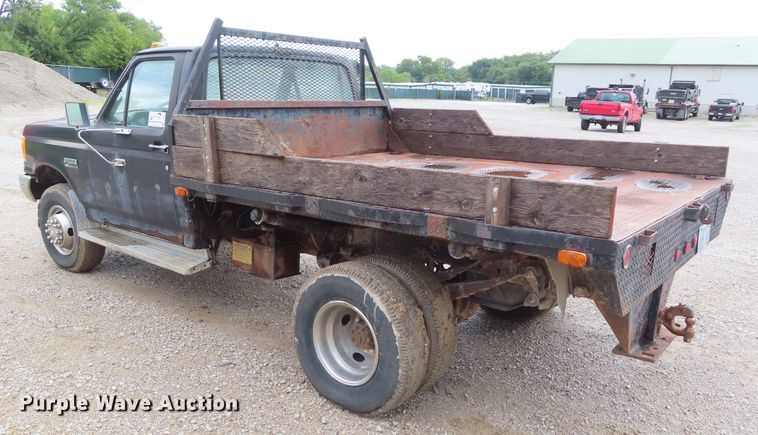 image for item DD6383 1990 Ford F450 Super Duty flat dump bed truck