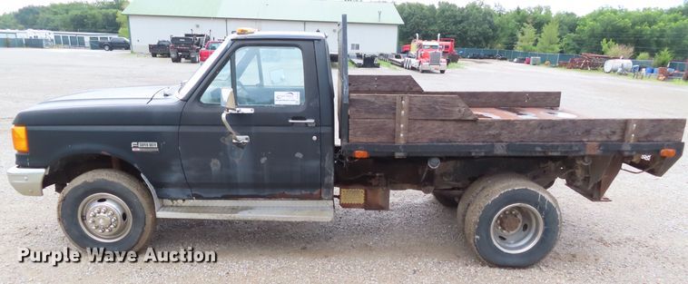 image for item DD6383 1990 Ford F450 Super Duty flat dump bed truck