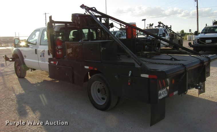 image for item DG1406 2016 Ford F550 Super Duty Crew Cab flatbed truck