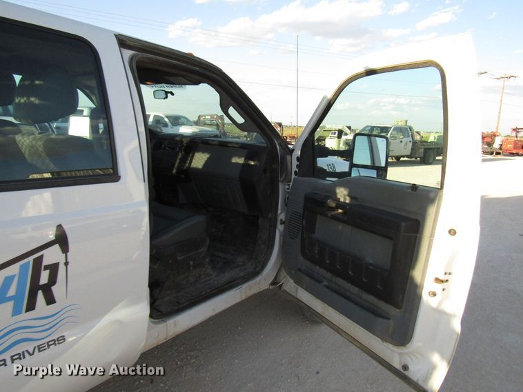 image for item DG1406 2016 Ford F550 Super Duty Crew Cab flatbed truck