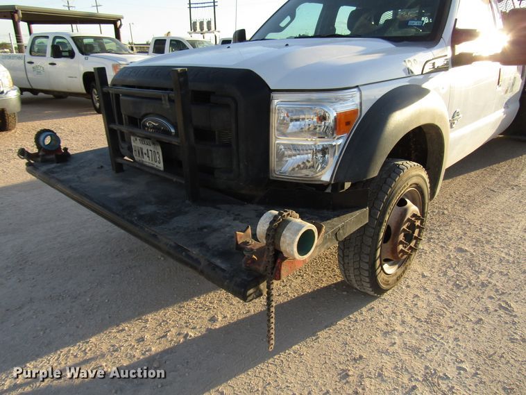 image for item DG1406 2016 Ford F550 Super Duty Crew Cab flatbed truck