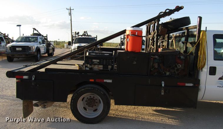 image for item DG1406 2016 Ford F550 Super Duty Crew Cab flatbed truck