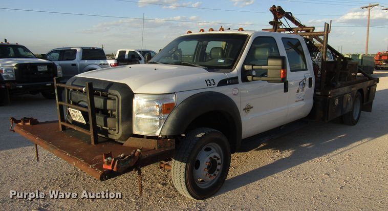 image for item DG1407 2014 Ford F550 Super Duty Crew Cab flatbed truck