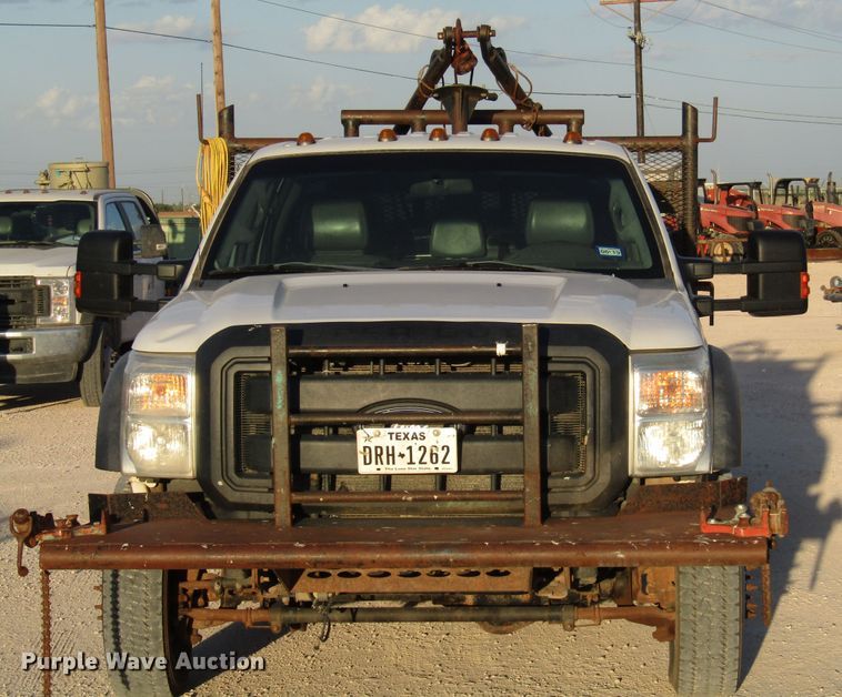 image for item DG1407 2014 Ford F550 Super Duty Crew Cab flatbed truck