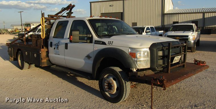 image for item DG1407 2014 Ford F550 Super Duty Crew Cab flatbed truck