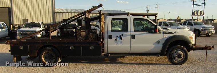 image for item DG1407 2014 Ford F550 Super Duty Crew Cab flatbed truck