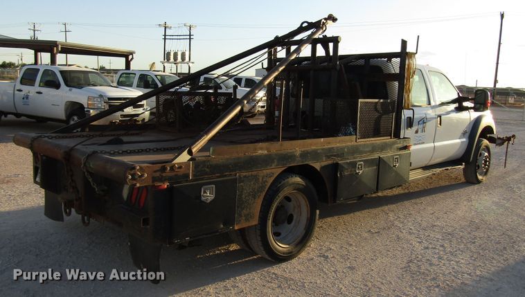 image for item DG1407 2014 Ford F550 Super Duty Crew Cab flatbed truck