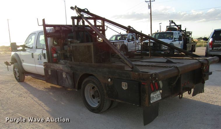 image for item DG1407 2014 Ford F550 Super Duty Crew Cab flatbed truck