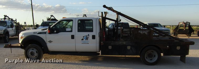 image for item DG1407 2014 Ford F550 Super Duty Crew Cab flatbed truck