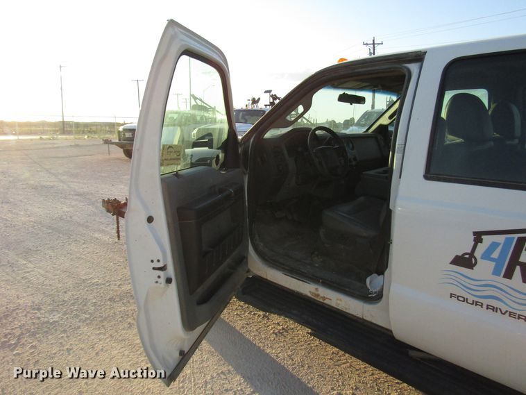 image for item DG1407 2014 Ford F550 Super Duty Crew Cab flatbed truck