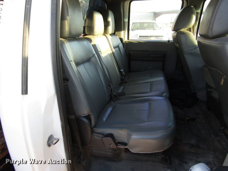 image for item DG1407 2014 Ford F550 Super Duty Crew Cab flatbed truck