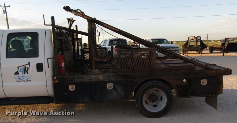 image for item DG1407 2014 Ford F550 Super Duty Crew Cab flatbed truck