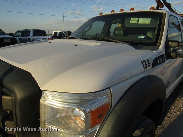 image for item DG1407 2014 Ford F550 Super Duty Crew Cab flatbed truck