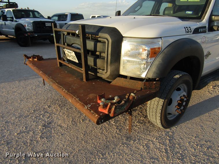 image for item DG1407 2014 Ford F550 Super Duty Crew Cab flatbed truck