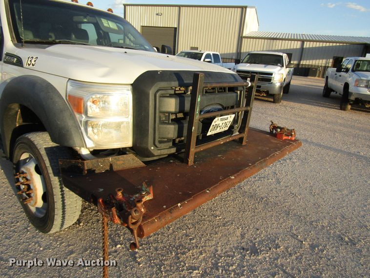 image for item DG1407 2014 Ford F550 Super Duty Crew Cab flatbed truck